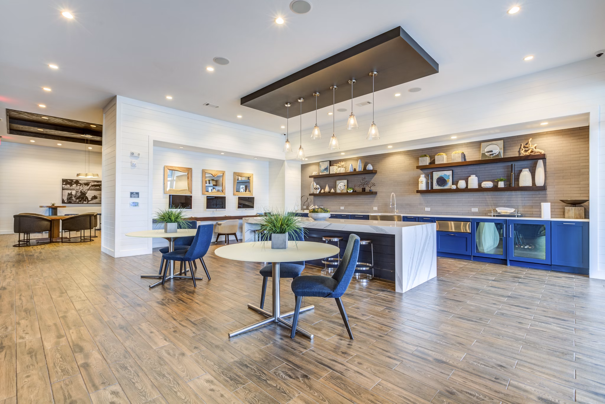 Upscale clubhouse with modern seating and decor at Element Barclay Apartments