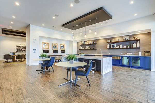 Upscale clubhouse with modern seating and decor at Element Barclay Apartments