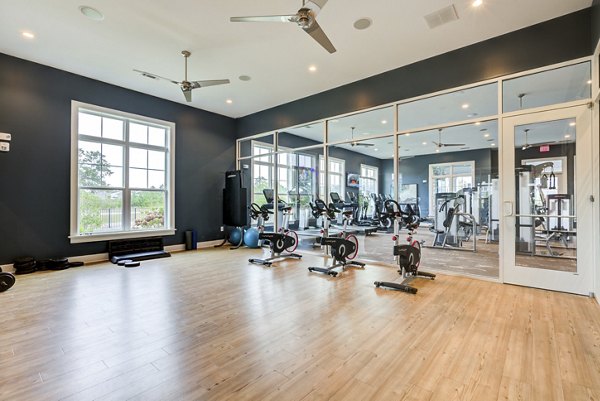 Yoga and spin studio with modern equipment at Element Barclay Apartments
