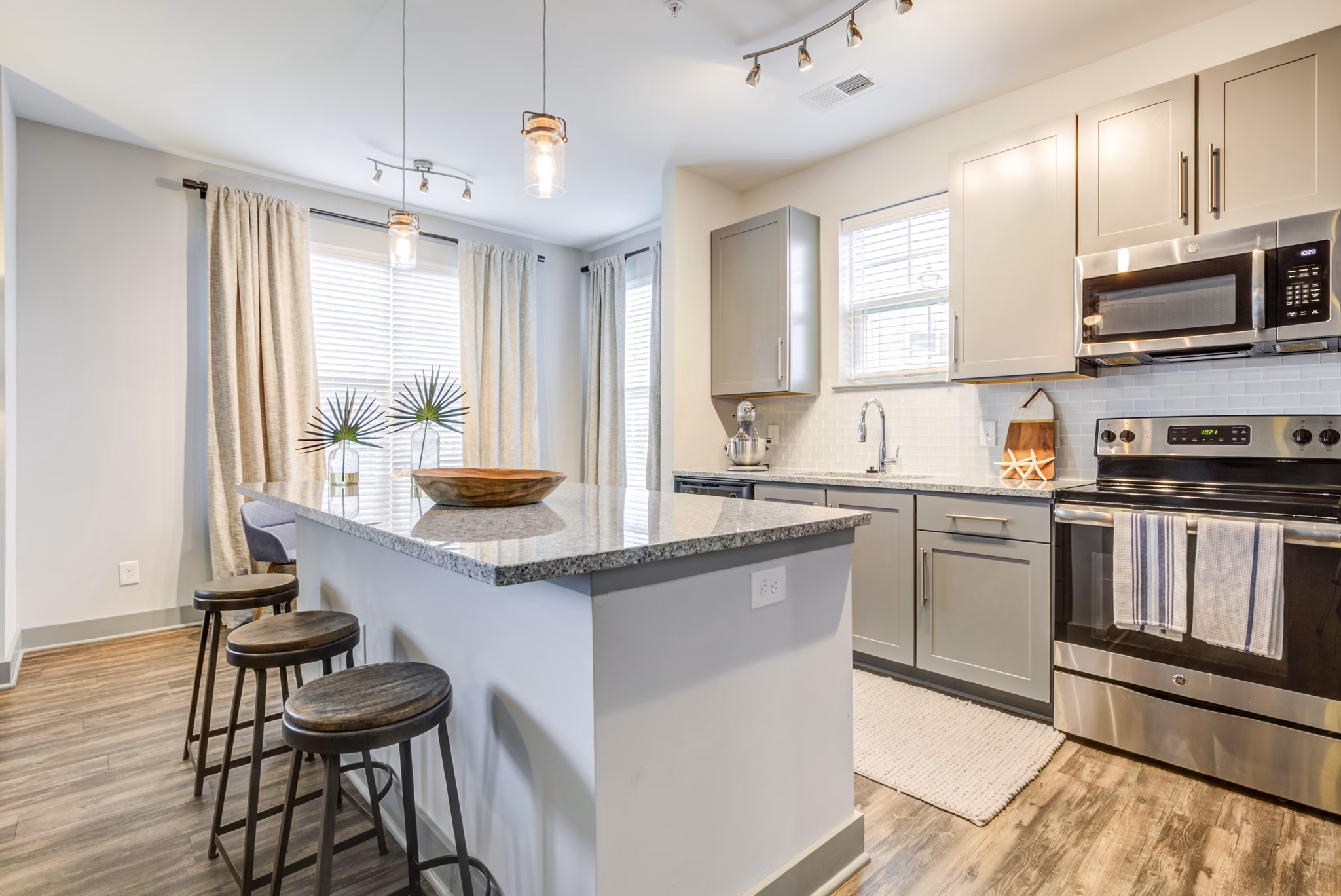 Modern kitchen with stainless steel appliances at Element Barclay Apartments offering luxury living spaces