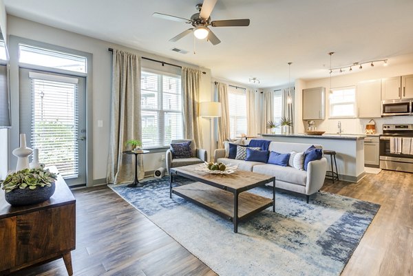 Cozy living room with contemporary design at Element Barclay Apartments, offering comfort and style in a luxury setting