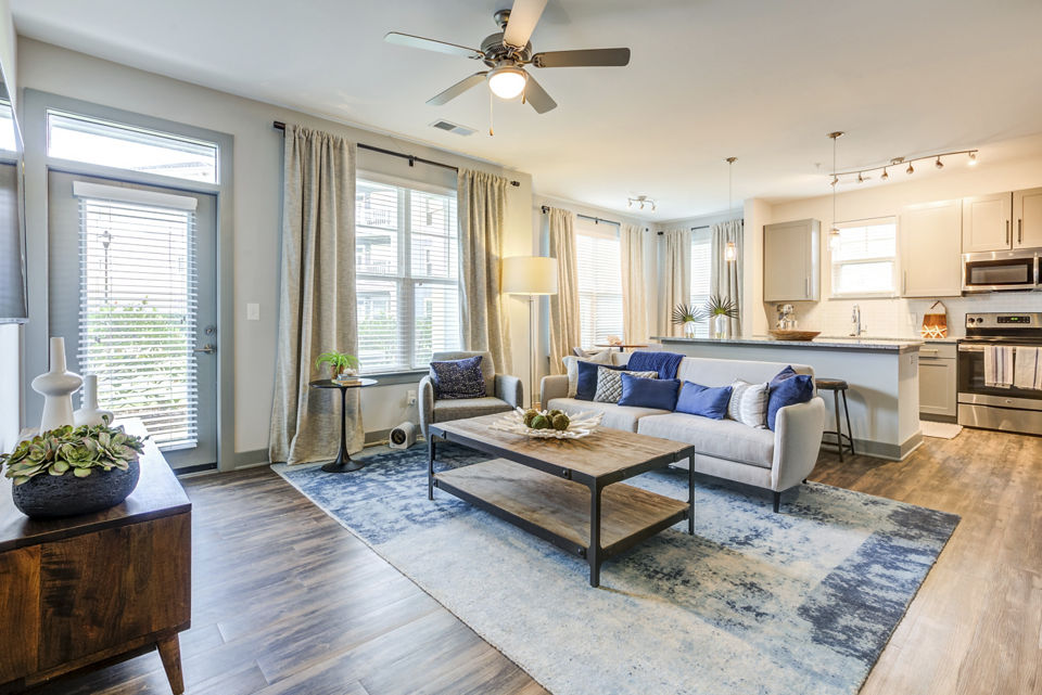 Cozy living room with contemporary design at Element Barclay Apartments, offering comfort and style in a luxury setting
