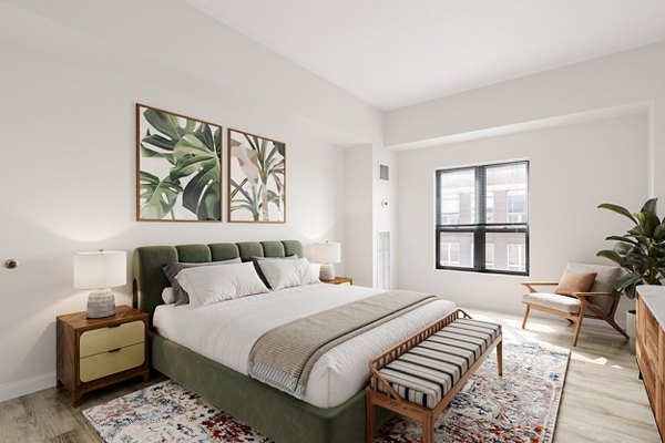 Cozy bedroom featuring modern furnishings at James and Harrison Court Apartments
