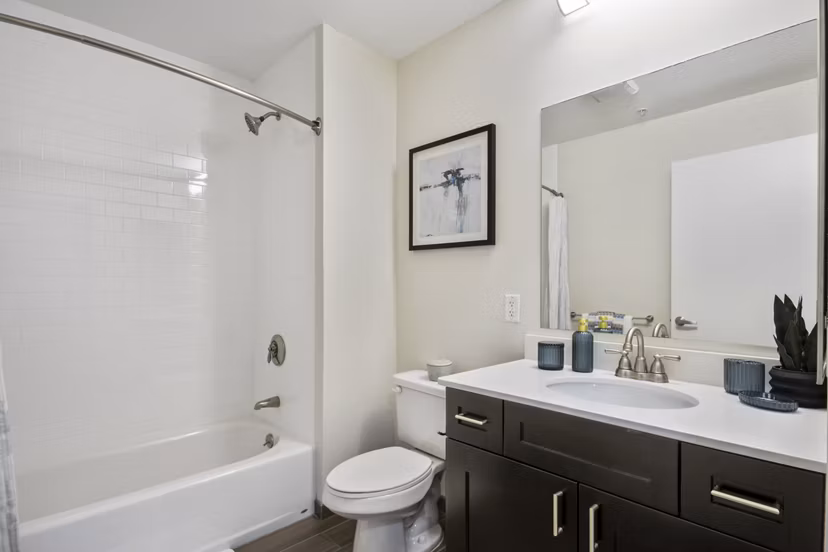 Modern bathroom featuring sleek fixtures in James and Harrison Court Apartments