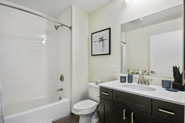 Modern bathroom featuring sleek fixtures in James and Harrison Court Apartments