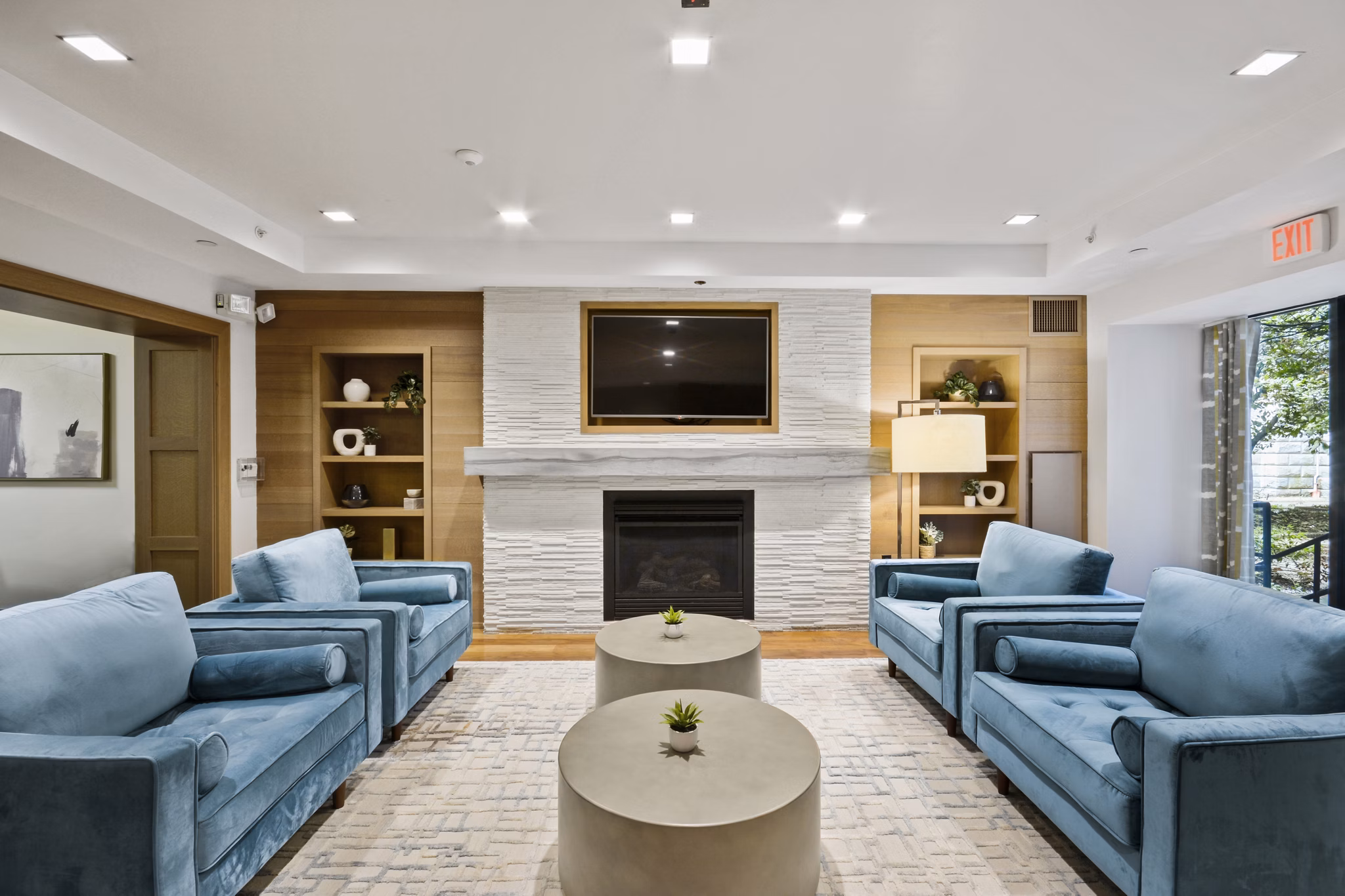 Clubhouse featuring modern decor and cozy seating areas at James and Harrison Court Apartments