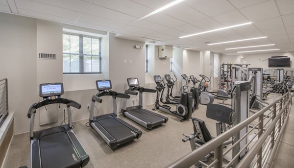 Modern fitness center with state-of-the-art equipment at James and Harrison Court Apartments