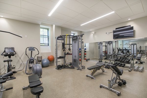 Modern fitness center with state-of-the-art equipment at James and Harrison Court Apartments