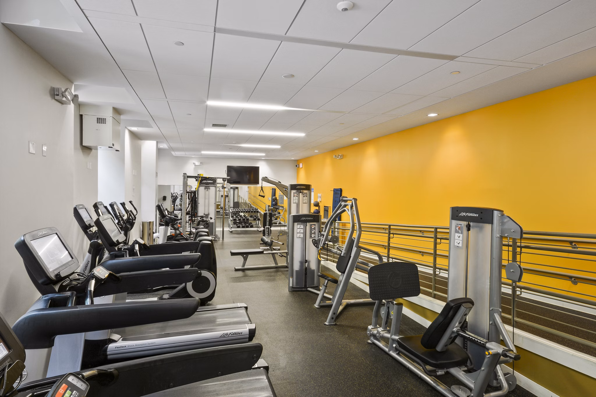 State-of-the-art fitness center with modern equipment at James and Harrison Court Apartments