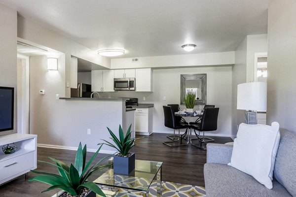 Living room with cozy seating and modern decor at Magnolia Ridge Apartments