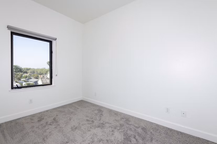 Cozy bedroom with modern decor in 1122 U Apartments in downtown, perfect for luxury living