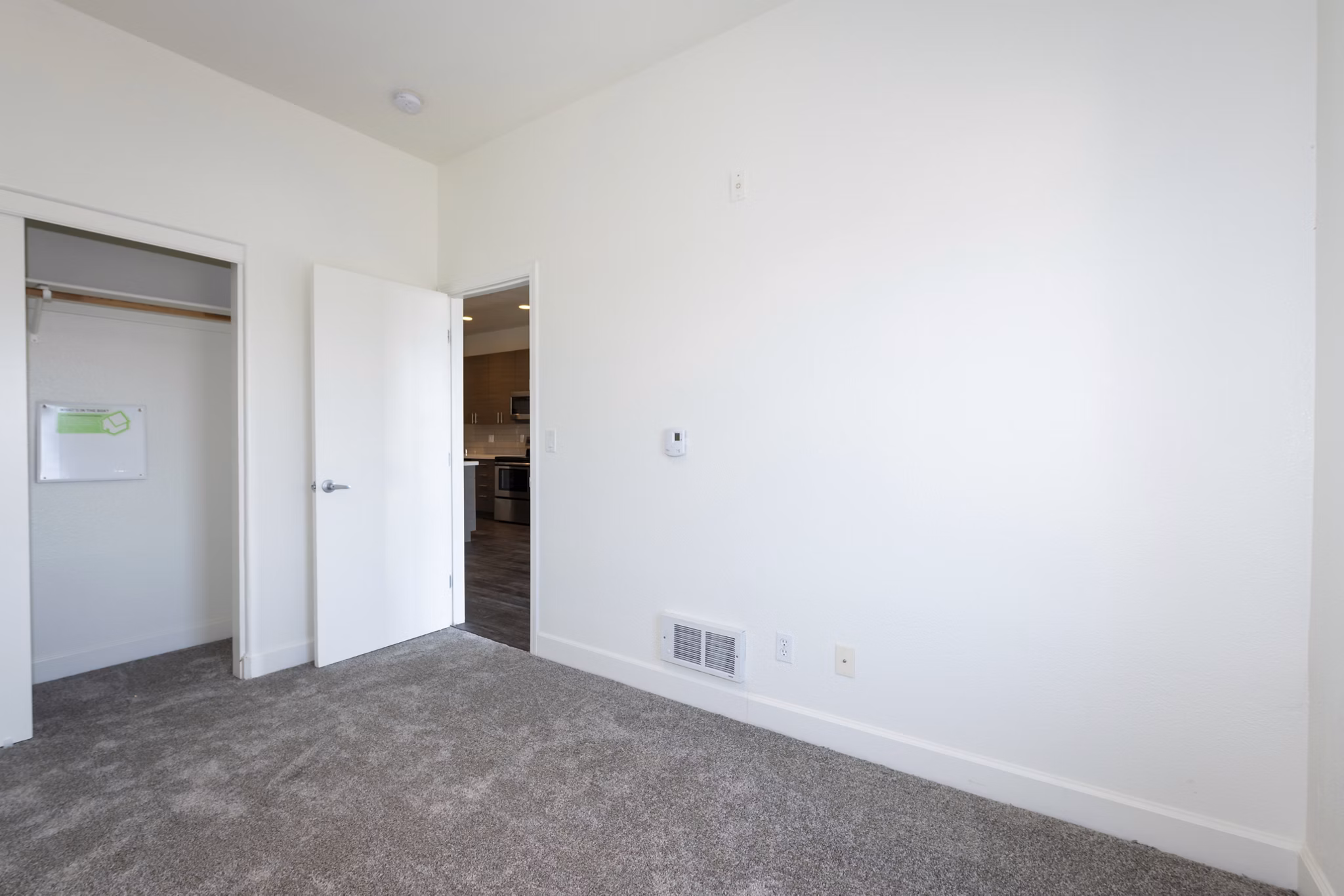 Cozy bedroom with stylish decor at 1122 U Apartments