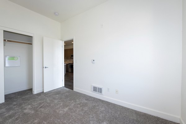 Cozy bedroom with stylish decor at 1122 U Apartments