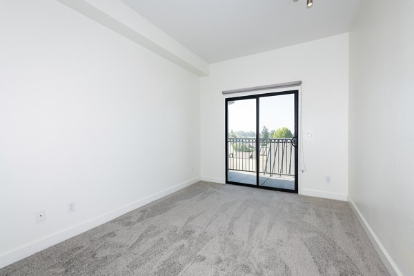 Modern bedroom with plush bedding in 1122 U Apartments