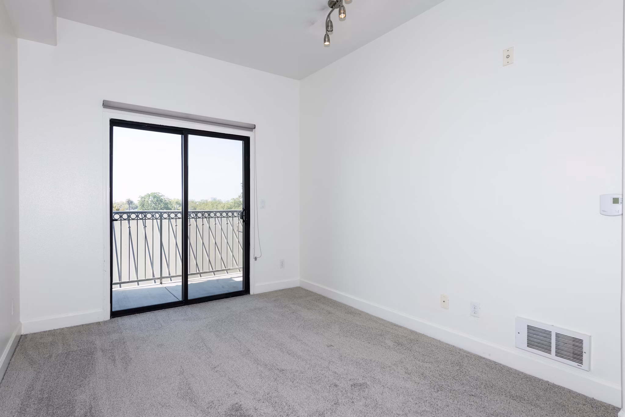 Bedroom featuring modern decor and ample natural light at 1122 U Apartments, a Greystar luxury property