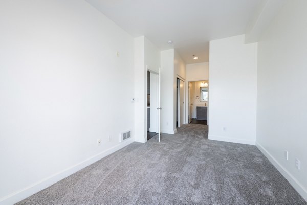 Cozy bedroom with elegant decor in 1122 U Apartments, showcasing luxury living in Greystar's exclusive community