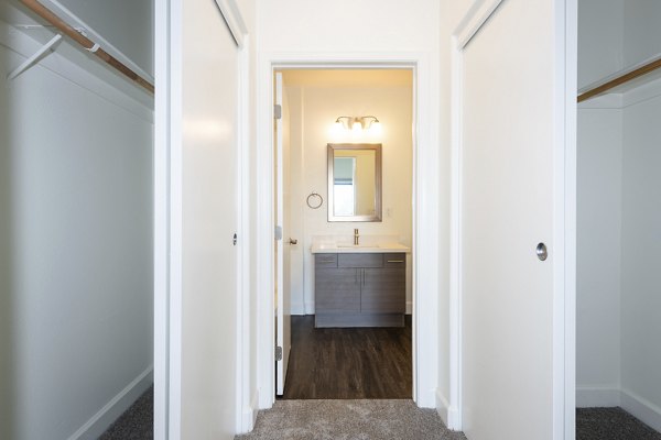 Walk-in closet with built-in shelving in 1122 U Apartments