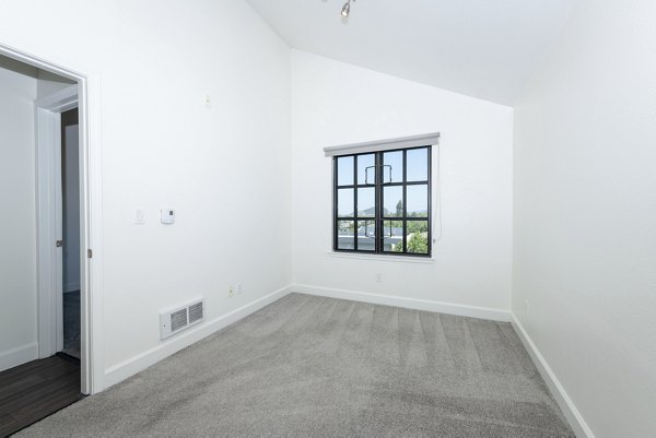 Luxurious bedroom with modern furnishings at 1122 U Apartments