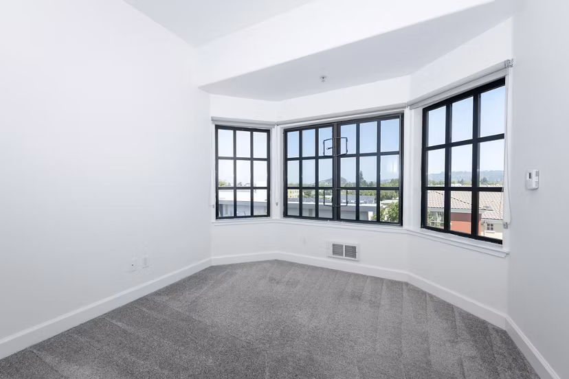 Elegant bedroom with modern furnishings at 1122 U Apartments, showcasing comfort and style in Greystar luxury apartments