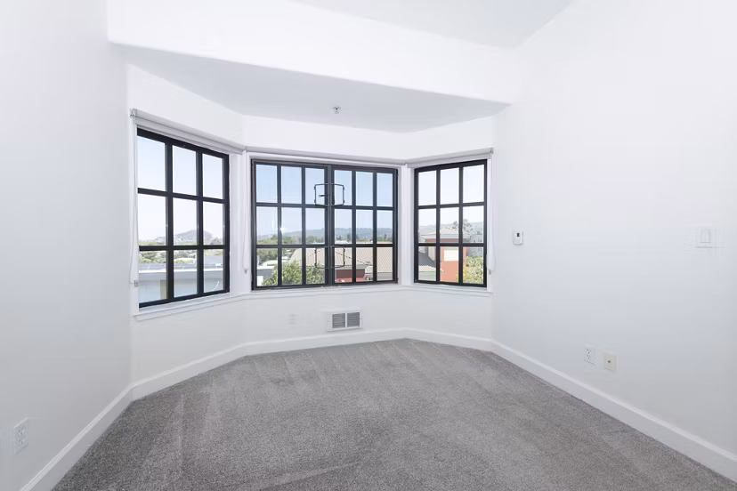 Elegant bedroom featuring king-size bed and modern decor at 1122 U Apartments