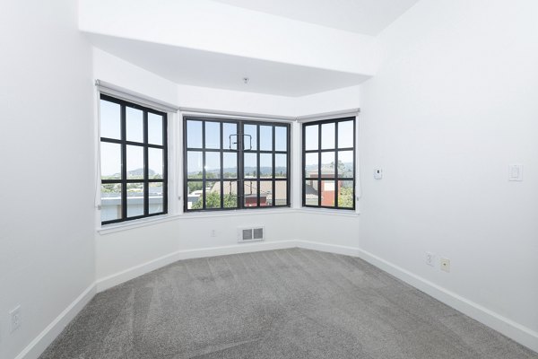 Elegant bedroom featuring king-size bed and modern decor at 1122 U Apartments