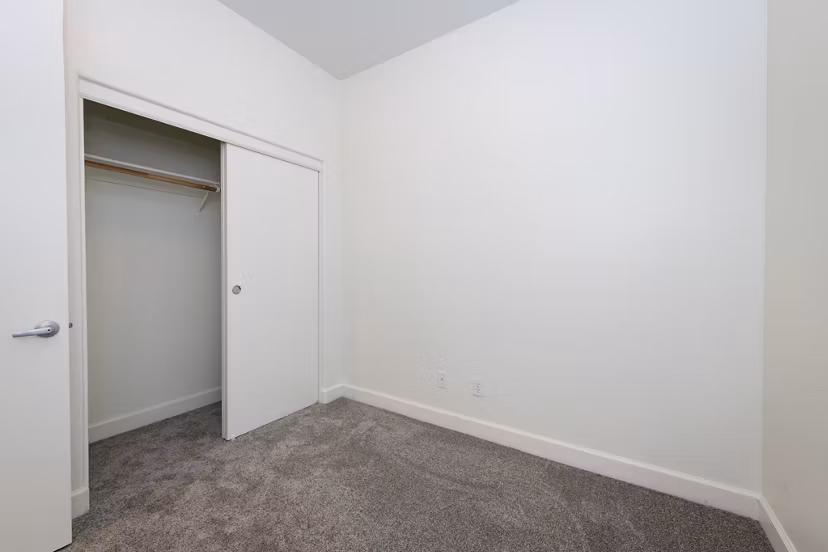 Cozy bedroom with modern decor at 1122 U Apartments