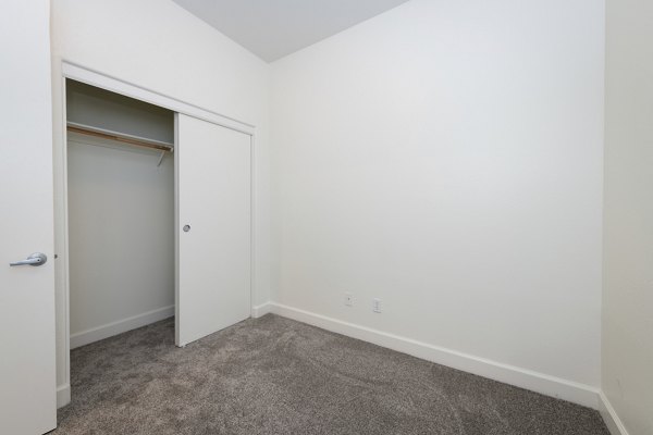 Cozy bedroom with modern decor at 1122 U Apartments