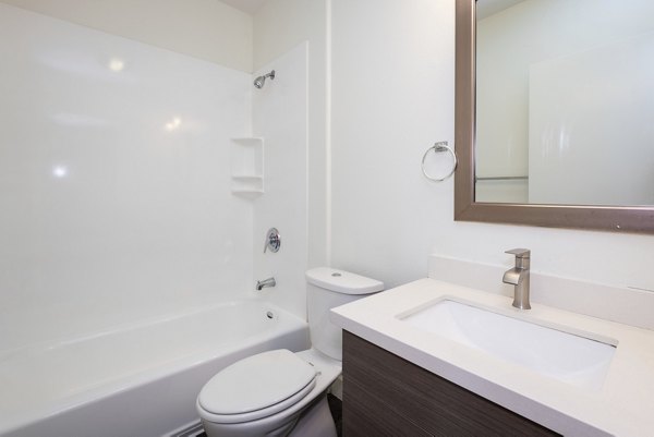 Modern bathroom with marble finishes at 1122 U Apartments