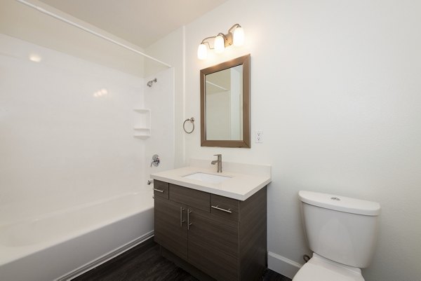 Modern bathroom with elegant fixtures at 1122 U Apartments, luxury living in a premier Greystar property