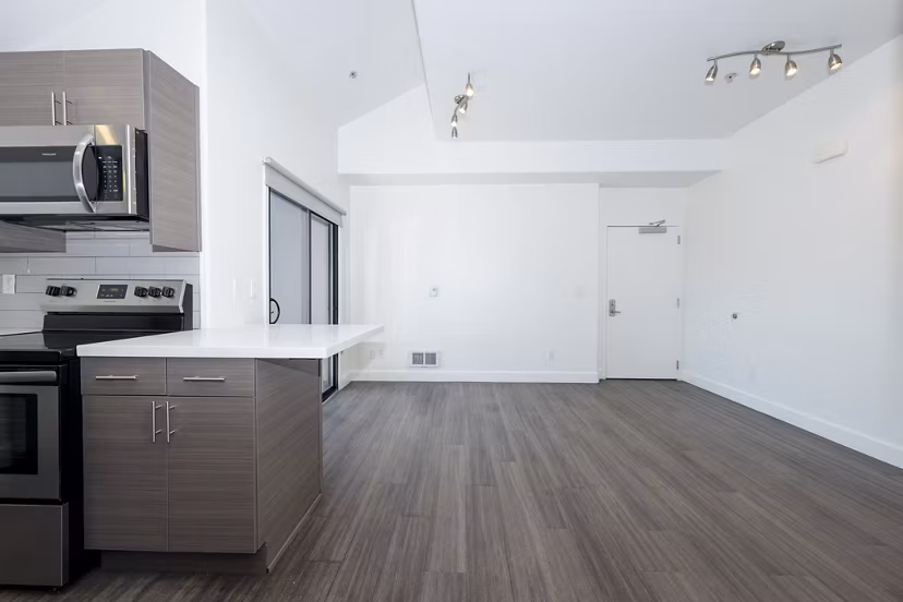Modern dining area with sleek furnishings at 1122 U Apartments, offering luxurious living spaces in a vibrant community