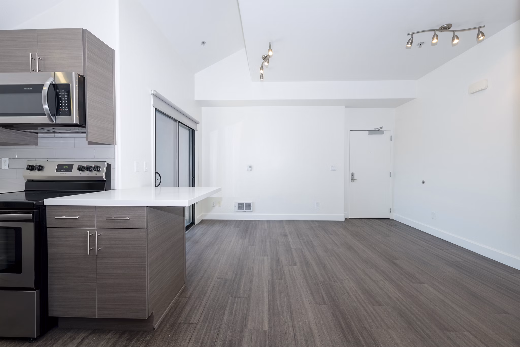 Modern dining area with sleek furnishings at 1122 U Apartments, offering luxurious living spaces in a vibrant community