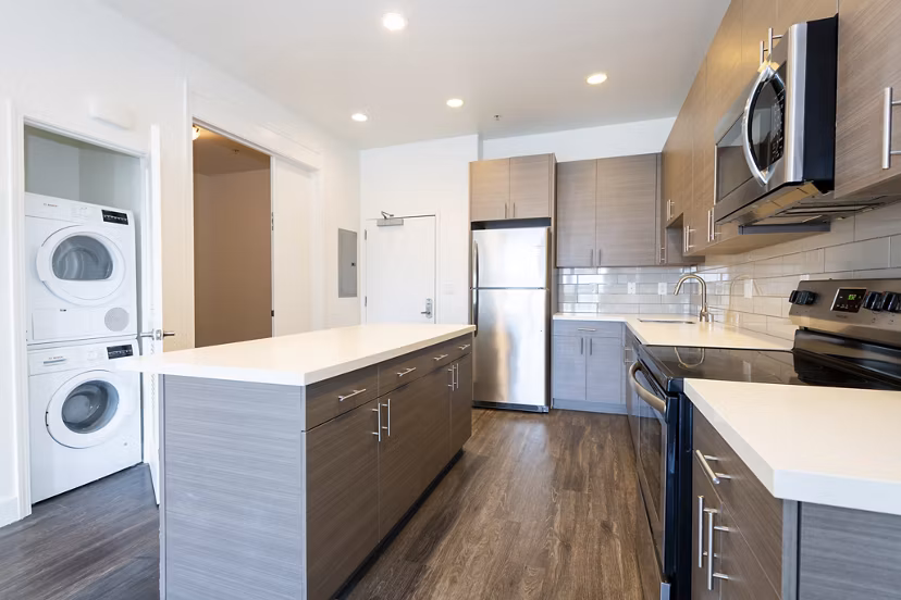 Modern kitchen with stainless steel appliances at 1122 U Apartments, offering luxury living in a vibrant neighborhood