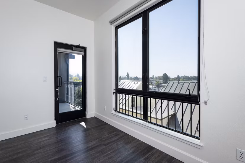 Stylish living room at 1122 U Apartments with modern furnishings and natural light, offering comfort and sophistication in urban living