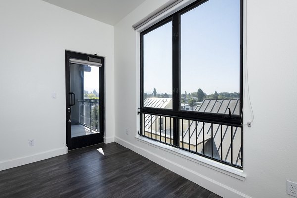 Stylish living room at 1122 U Apartments with modern furnishings and natural light, offering comfort and sophistication in urban living