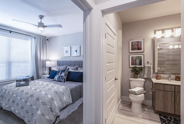 Modern bathroom with sleek fixtures at Overture Domain luxury apartments, featuring spacious countertops and elegant lighting