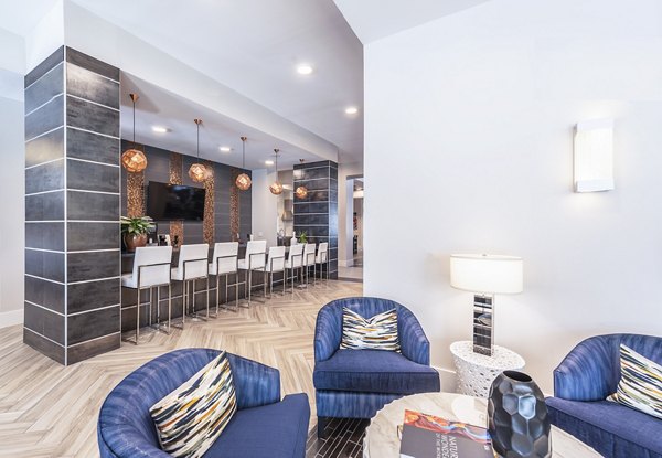 Stylish clubhouse with modern design at Overture Domain luxury apartments, perfect for social gatherings and events