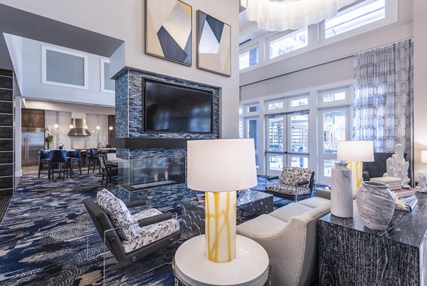 Elegant clubhouse with modern seating areas at Overture Domain luxury apartments