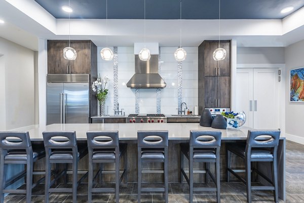 Modern clubhouse with cozy seating and fireplace at Overture Domain luxury apartments