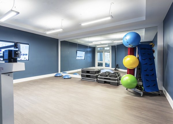 Modern fitness center with state-of-the-art equipment at Overture Domain luxury apartments