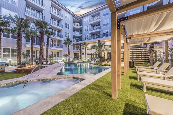 Relaxing outdoor pool at Overture Domain luxury apartments for active living and leisure
