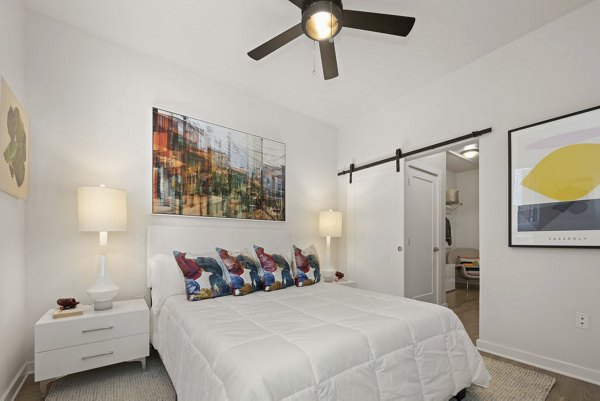 Cozy bedroom with modern decor at 30Six NoDa Apartments
