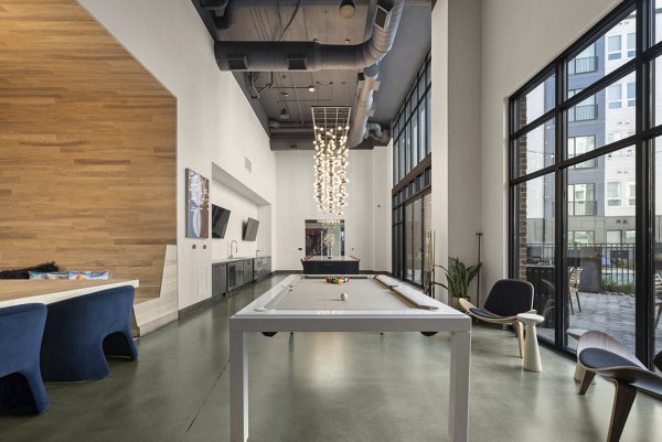 Game room with billiards and lounge area at 30Six NoDa Apartments