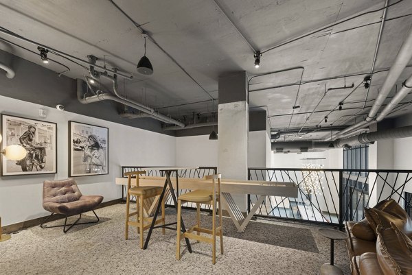 Game room featuring pool table and arcade games at 30Six NoDa Apartments