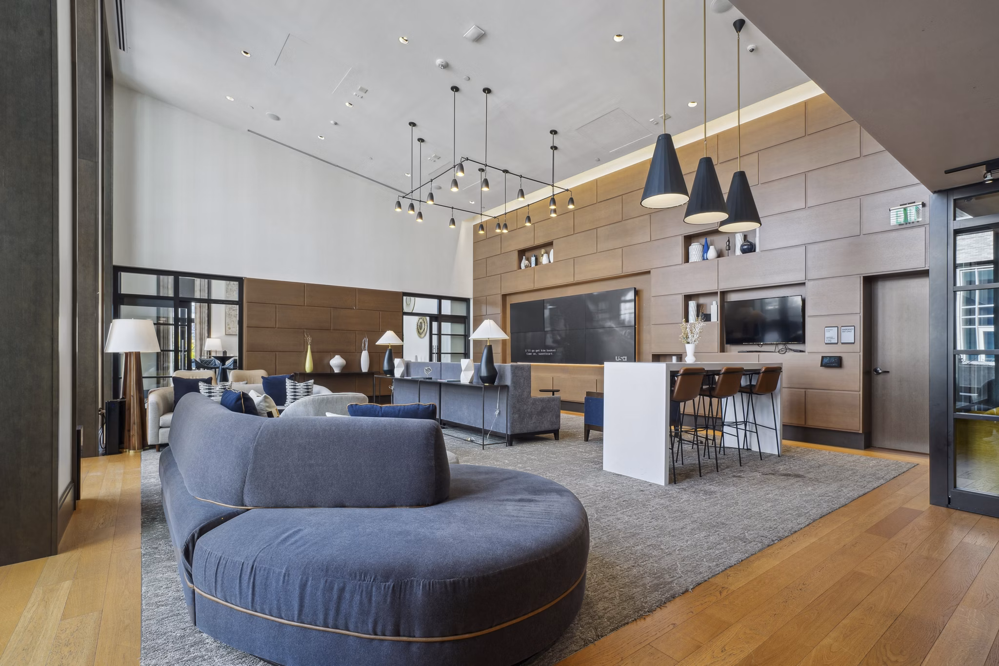Clubhouse with modern design and social seating areas at The Alexander Apartments