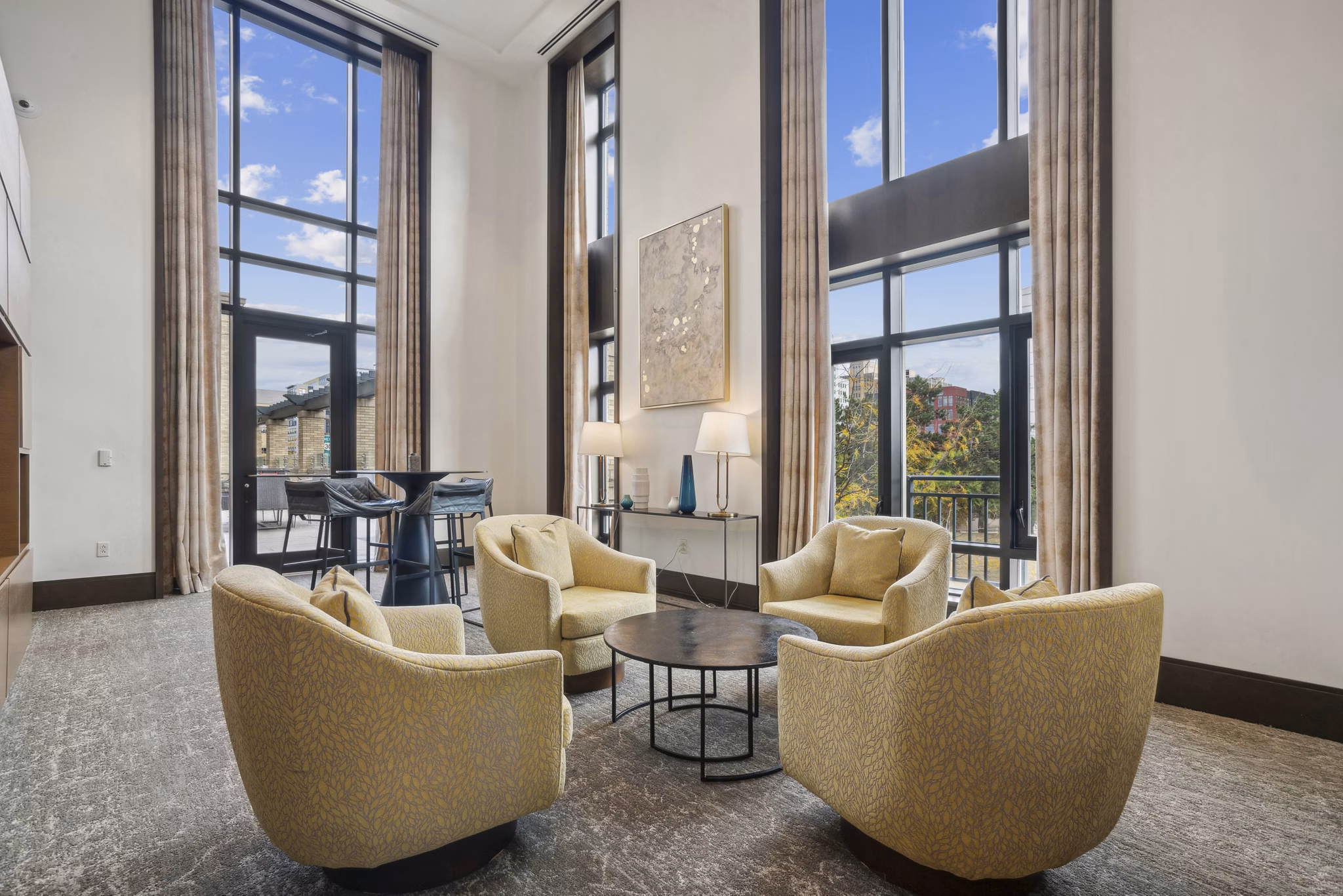 Clubhouse featuring modern design and luxury seating at The Alexander Apartments