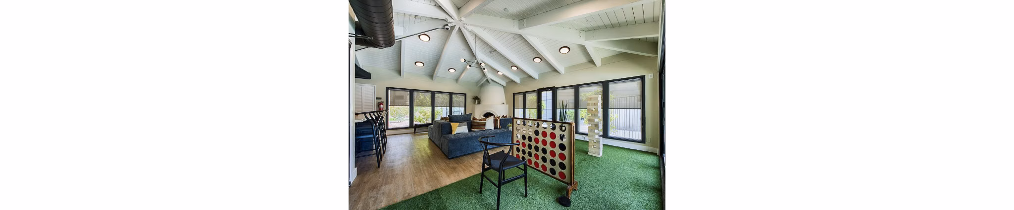 Vibrant game room with pool table and seating area at Avana at the Pointe Apartments