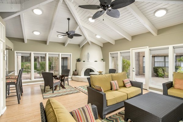Clubhouse featuring modern design and cozy seating at Avana at the Pointe Apartments
