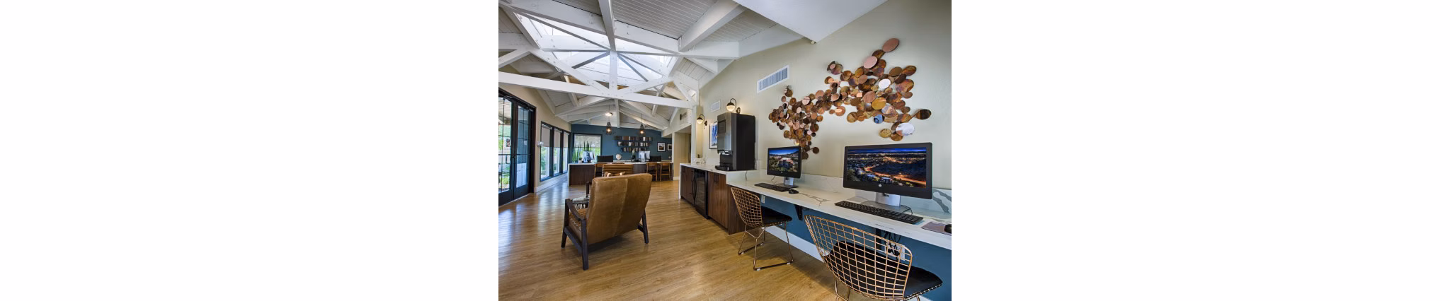 Avana at the Pointe: Elegant clubhouse lobby with modern decor and seating options at luxury apartments