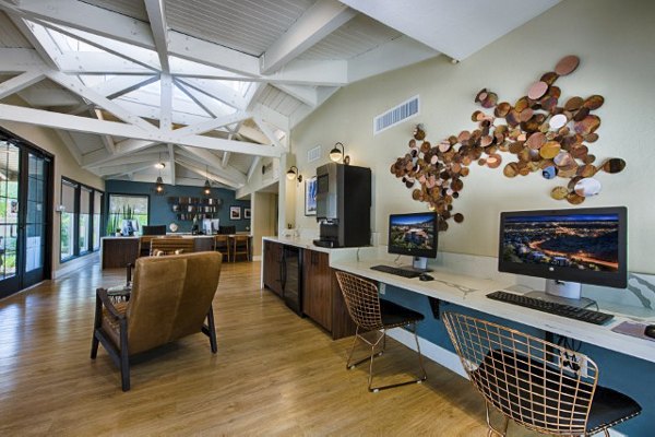 Avana at the Pointe: Elegant clubhouse lobby with modern decor and seating options at luxury apartments