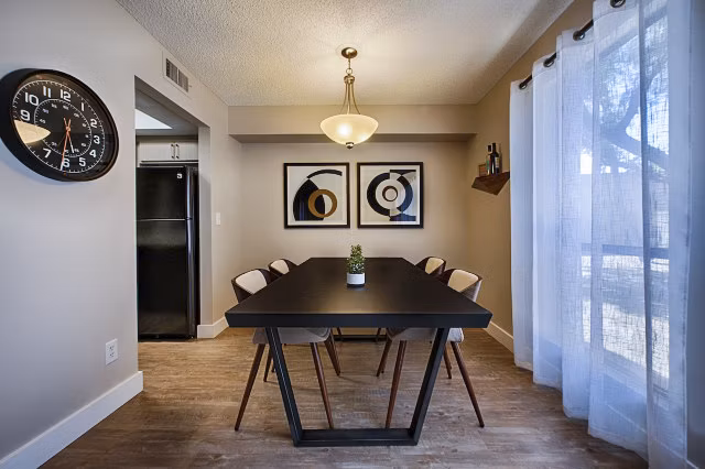 Dining area with modern decor and stylish seating at Avana at the Pointe Apartments